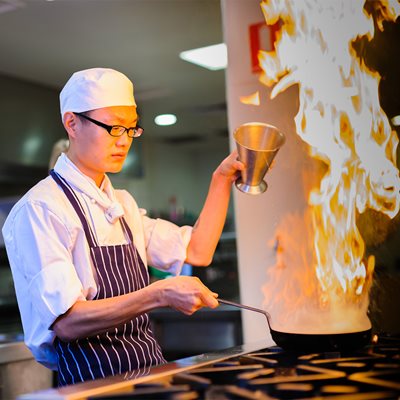 Bo Li international cookery student in the kitchen