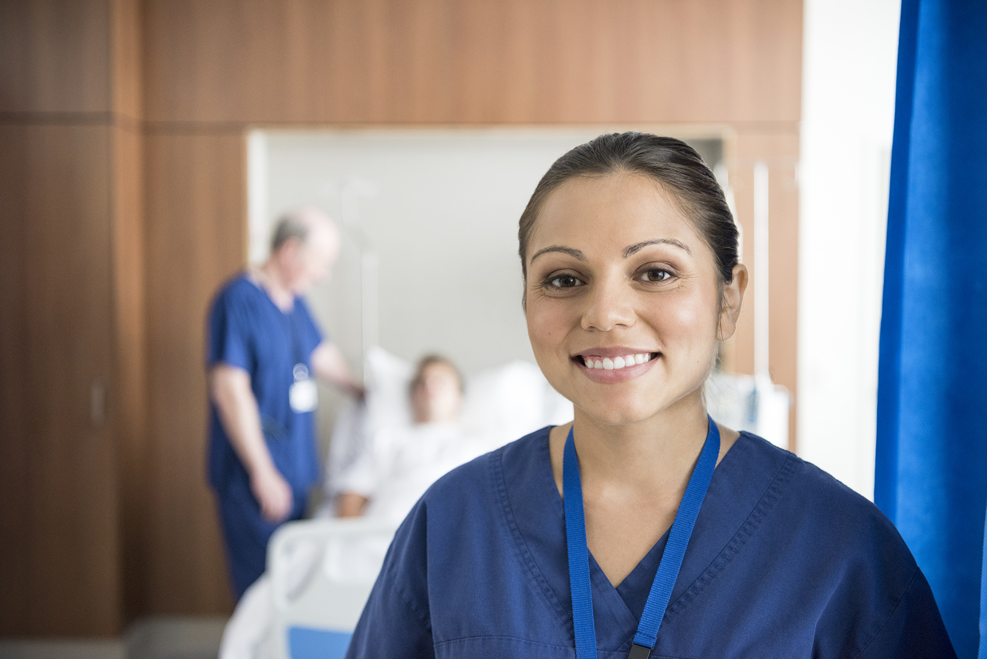 Photo of a nursing student wearing navy blue scrubs