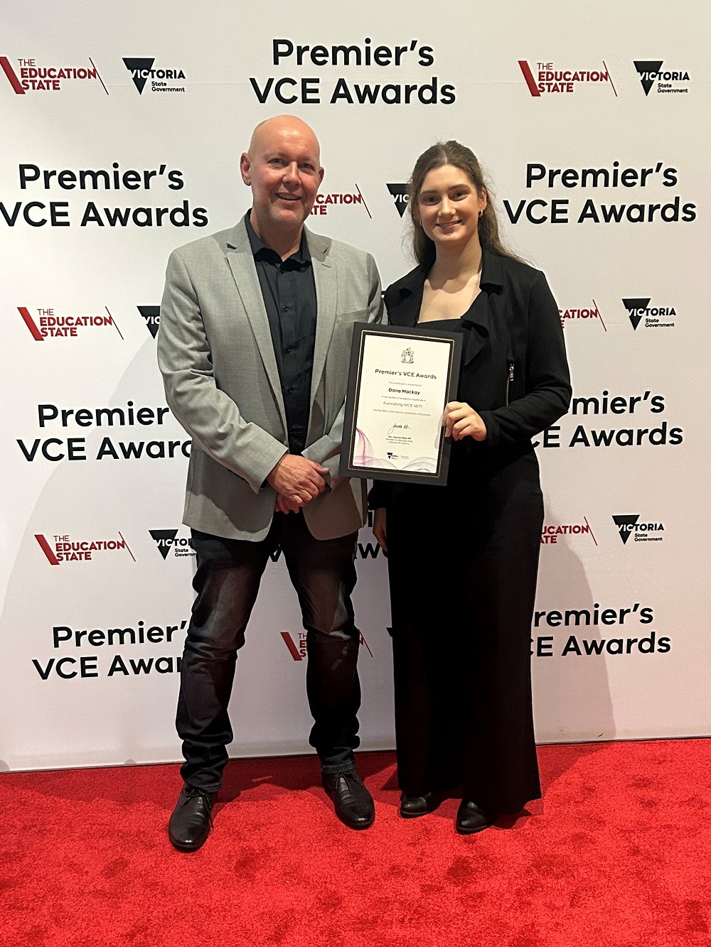 Image of Premier's Award honouree Dana Mackay with VET Furniture Making (The Gordon) teacher Mark Dries