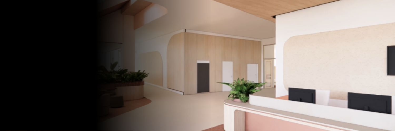 Interior view of a new reception area within the Centre of Excellence in Disability Inclusion build, featuring curved timber walls, built‑in seating with plants, and an open, accessible layout