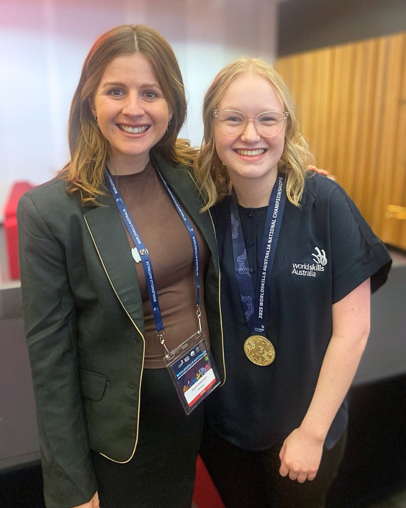 Floristry Teacher/Mentor Dayne Robinson with Gold medalist Floristry student, Charlotte Follett.