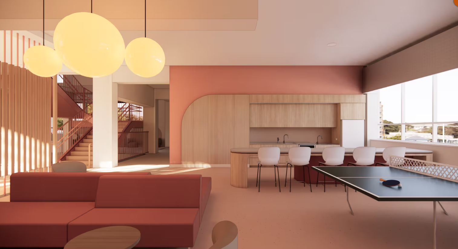 Social space with kitchen facilties, booth seating, communal tables and table tennis