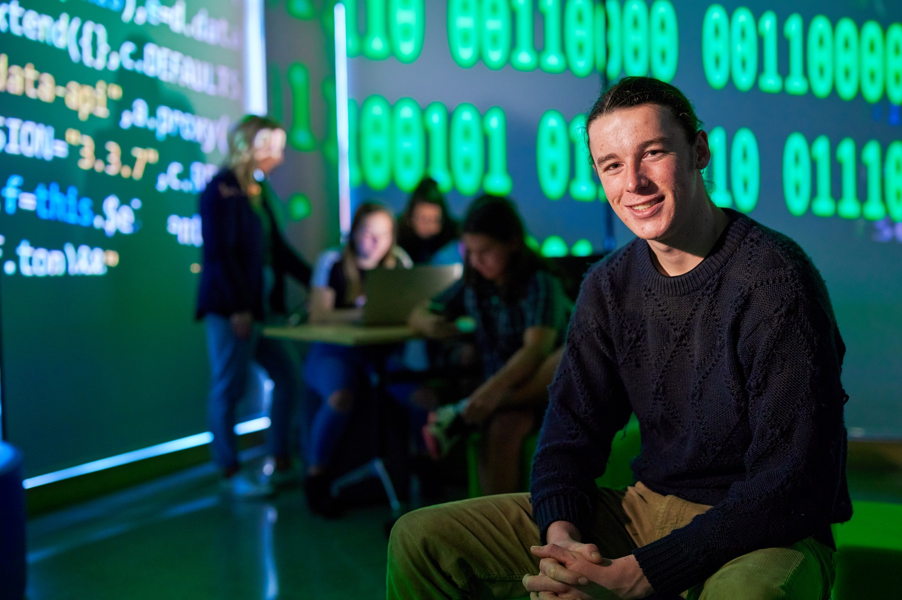 Image of student emersed in IT environment