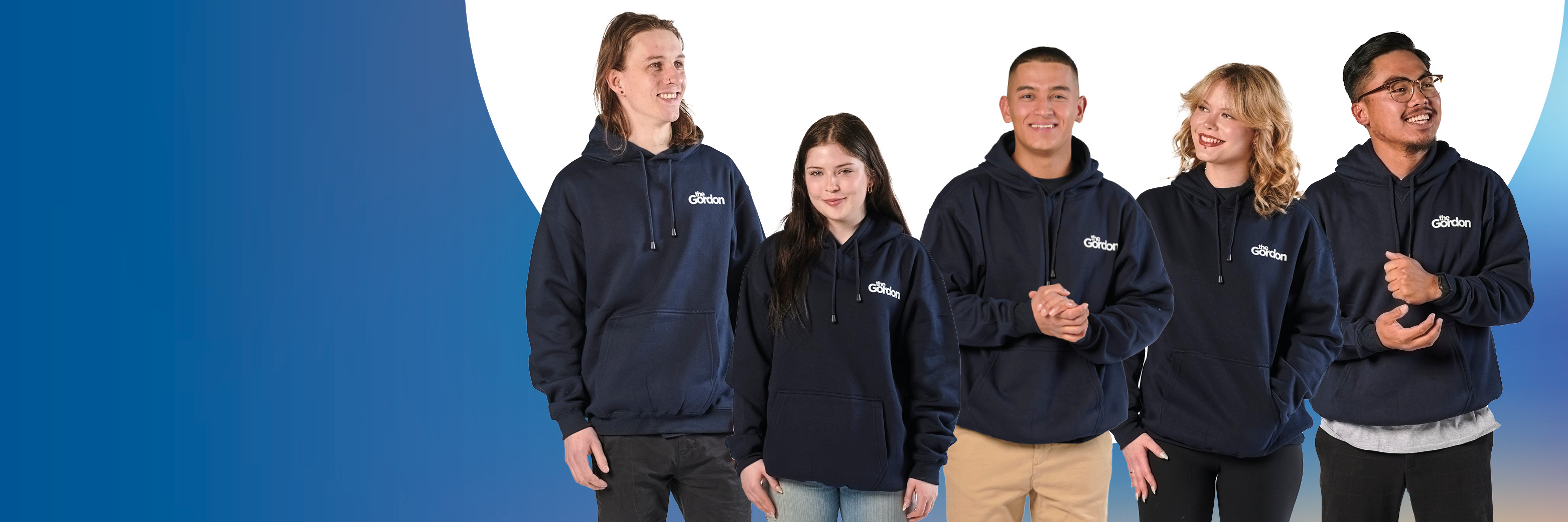 Five people standing side by side wearing matching dark-colored Gordon hoodies