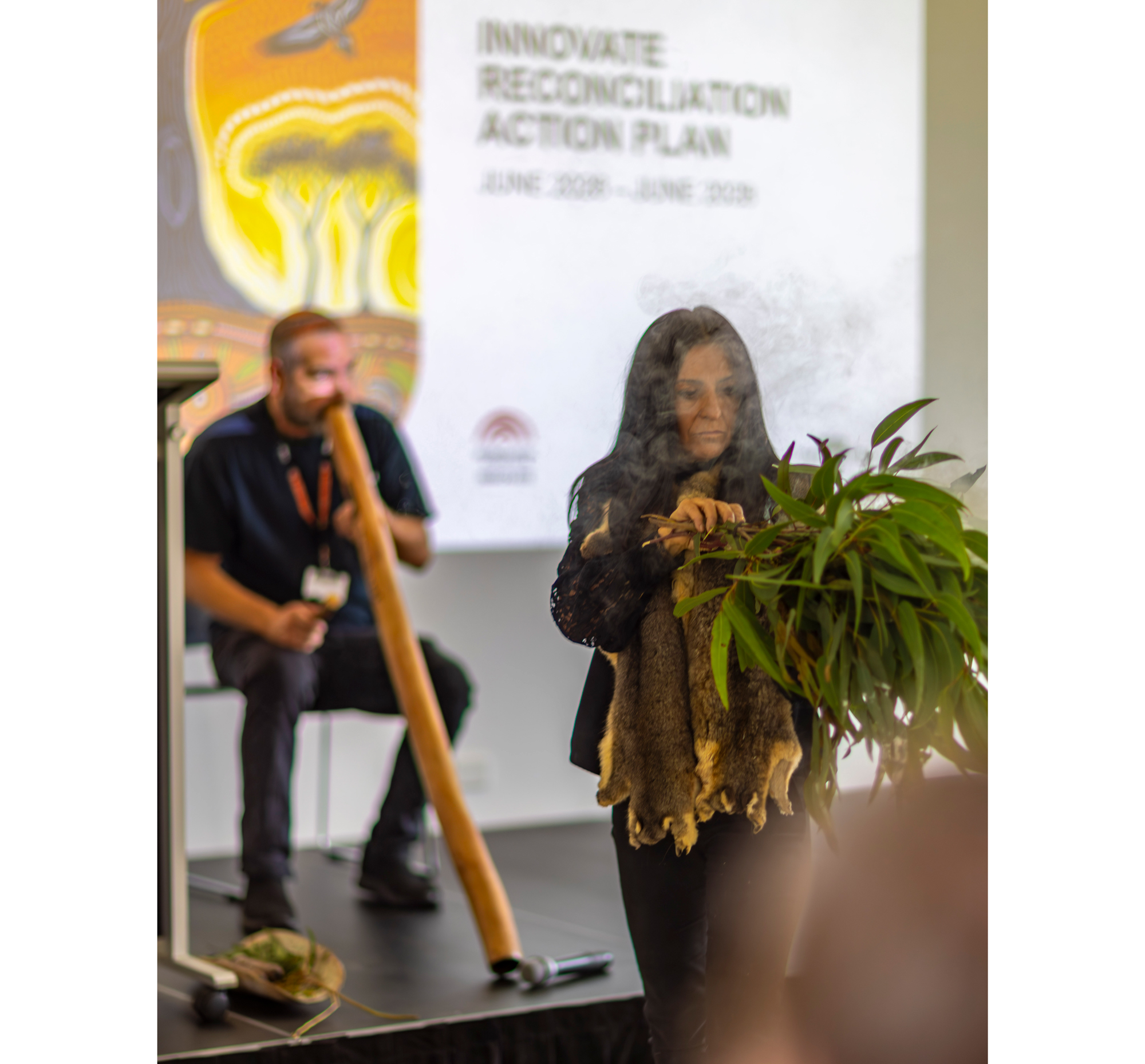 Image of Anthony Hume and Corrina Eccles performing smoking ceremony