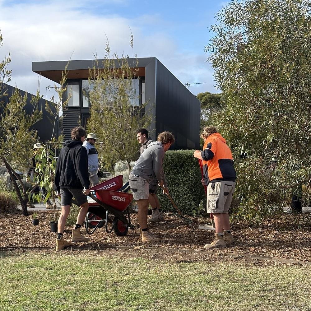 The Gordon’s Landscaping program students in action digging and working, planting trees.