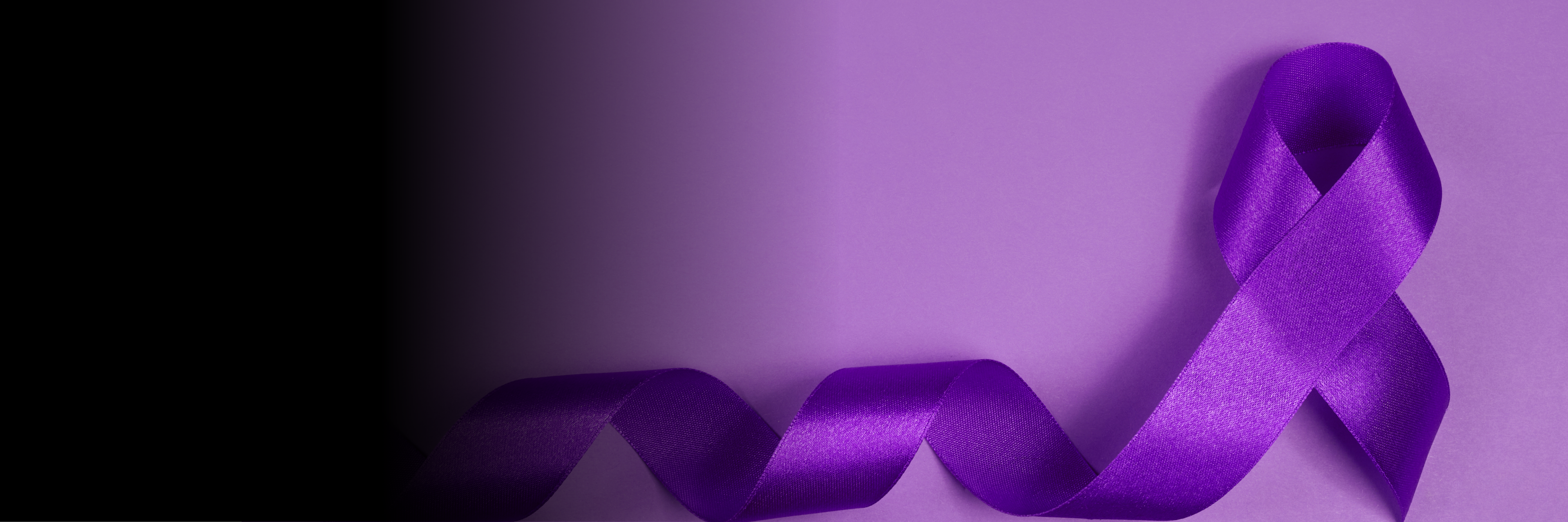 Purple ribbon on purple background