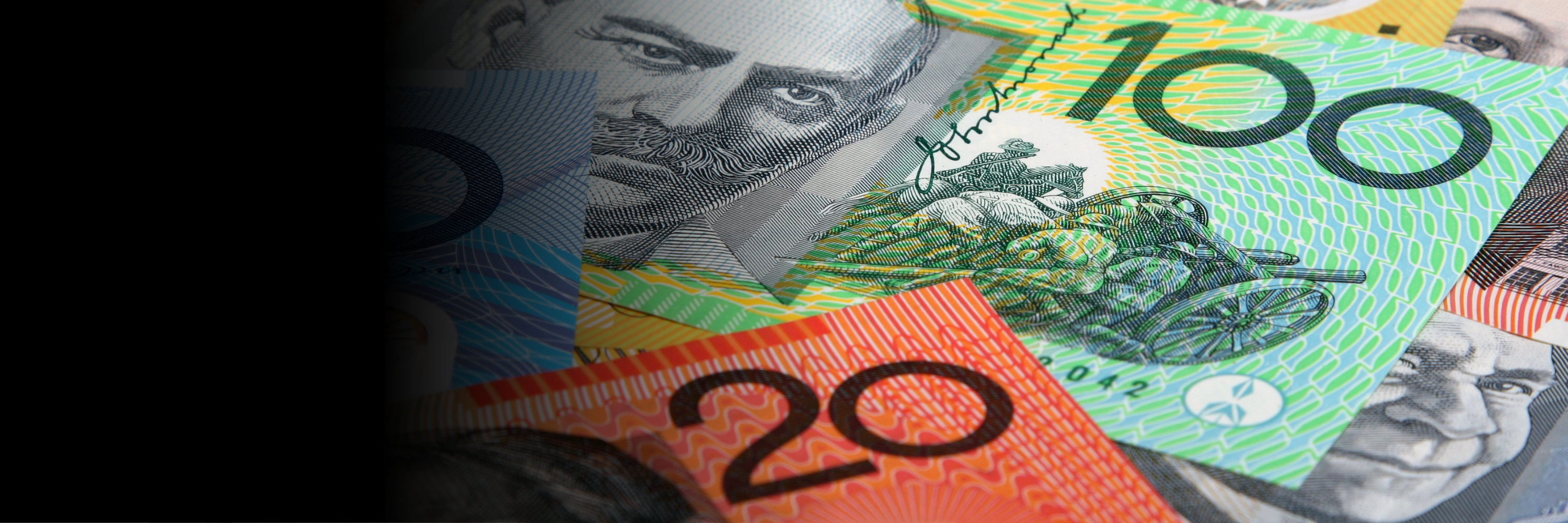 Overlapping Australian banknotes, including $20, $50 and $100 notes